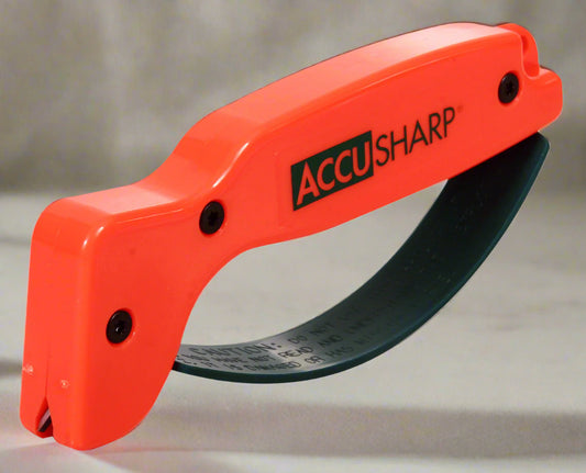 AccuSharp knife sharpener with orange handle on a white background